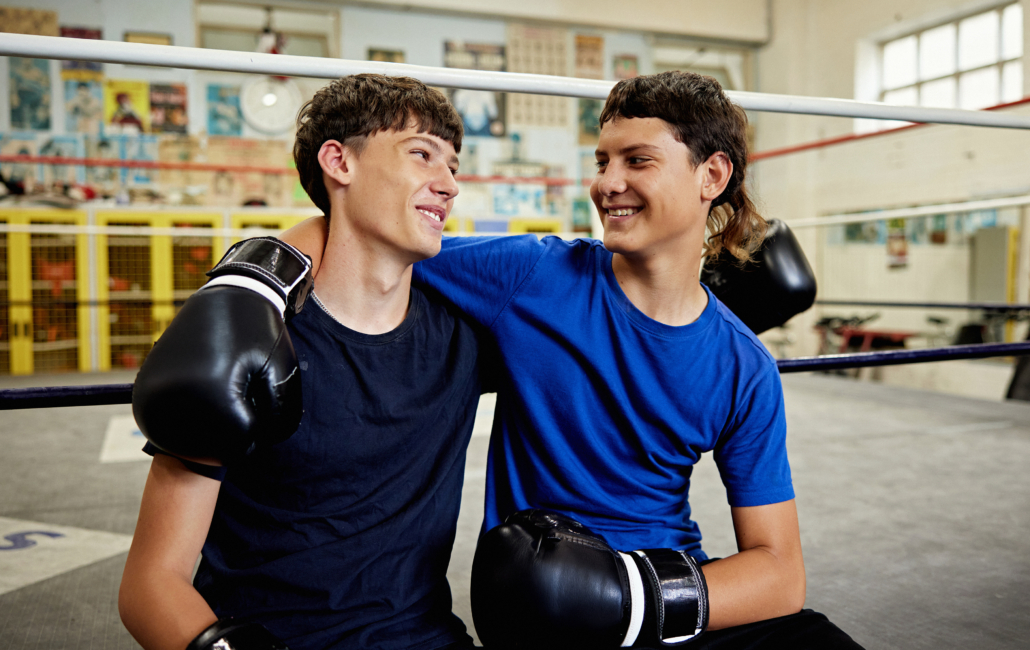 Teenage boys boxing
