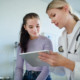 Teenage girl and pediatric orthopedic surgeon